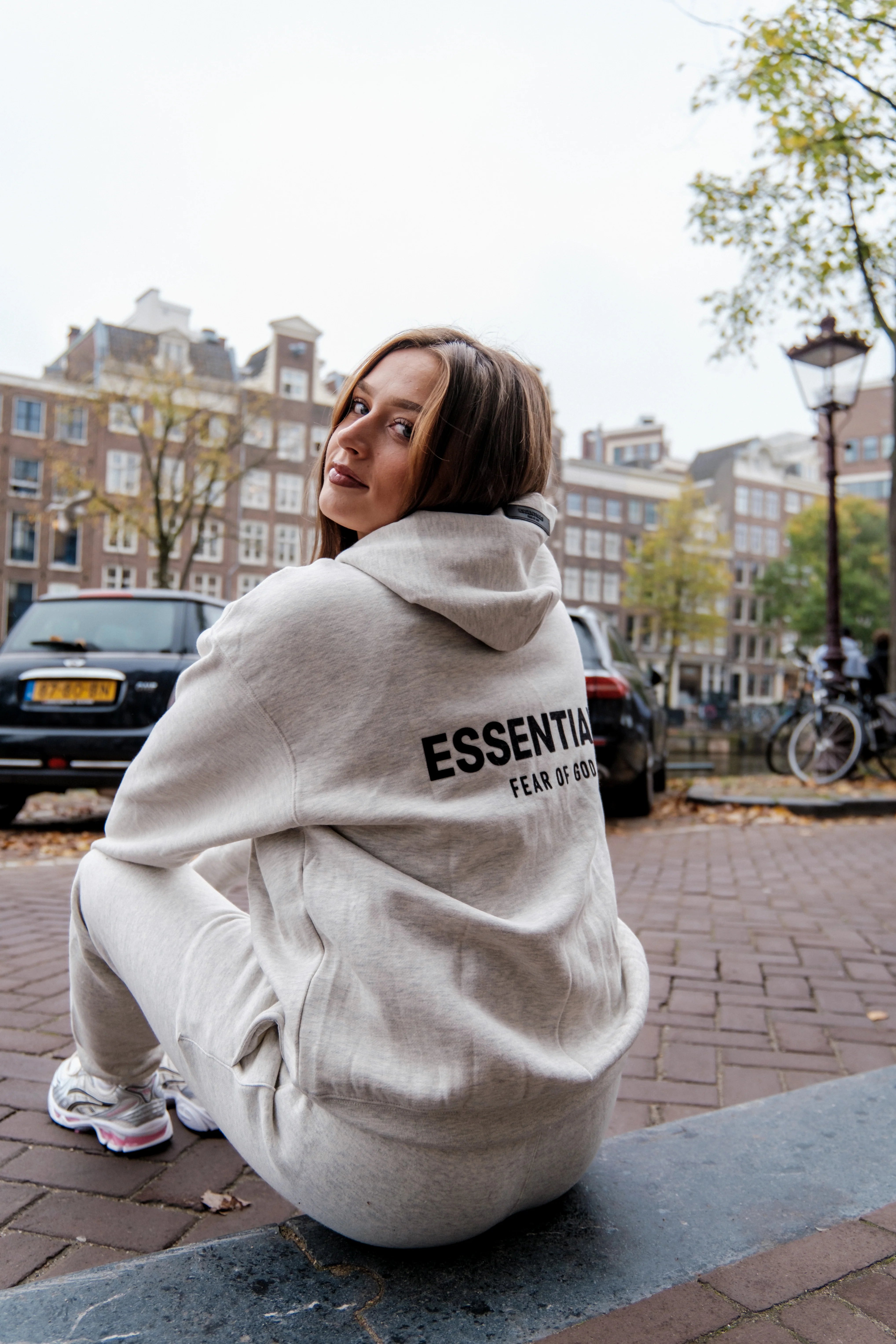 Fear of God Essentials Hoodie FW22 Light Oatmeal Outfit Back